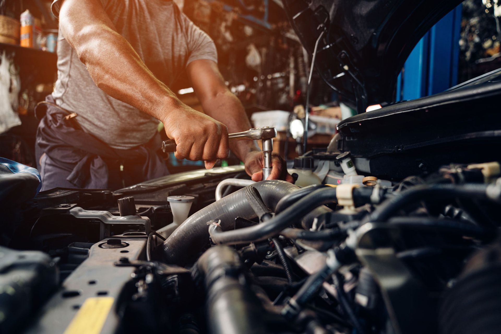 Mechanic working on an engine in a garage